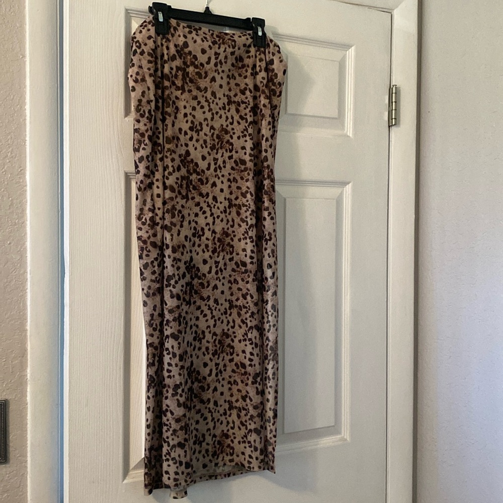 Animal print skirt . Sheer with side slit and mini skirt below